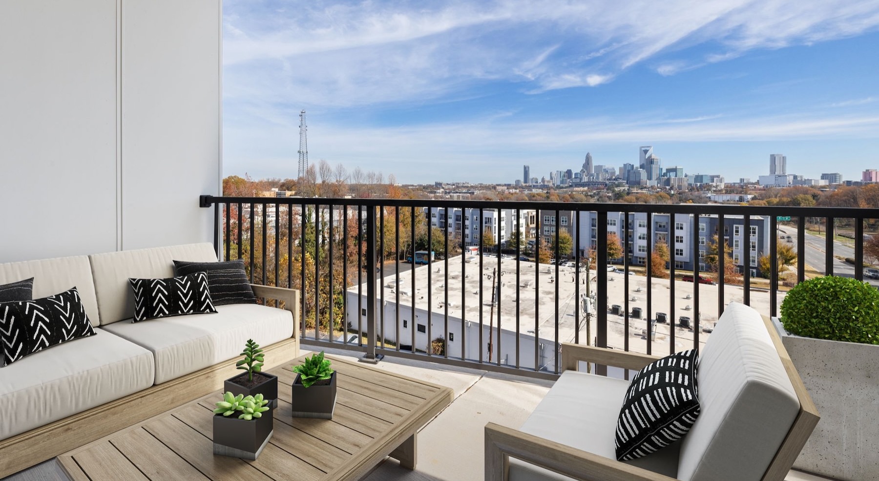a balcony with couches and a view