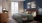 bedroom with a large window and decor