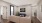 living room with a plant, coffee table, and couch